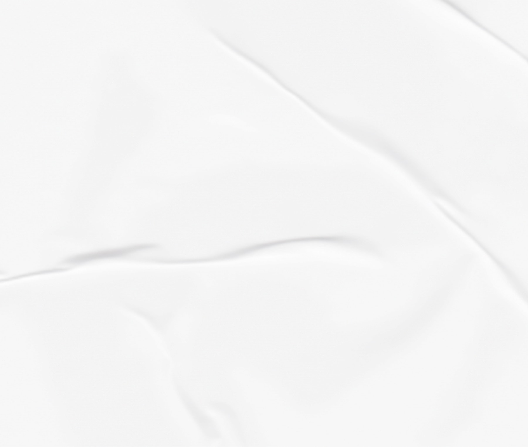 Wrinkled white fabric background texture.