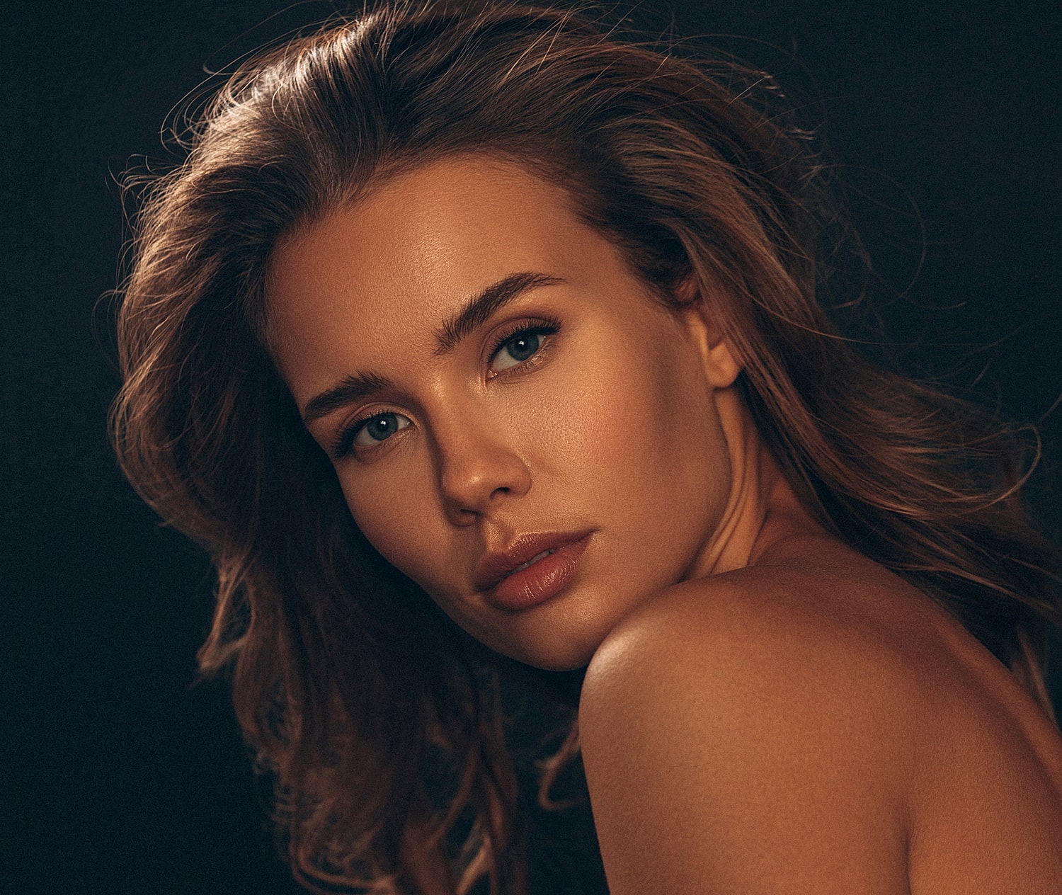 Portrait of a woman with flowing hair.