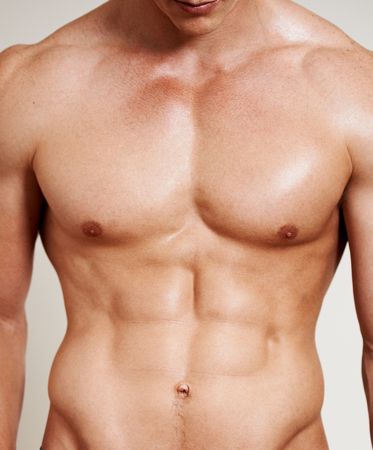 Male torso with defined abs and smooth skin