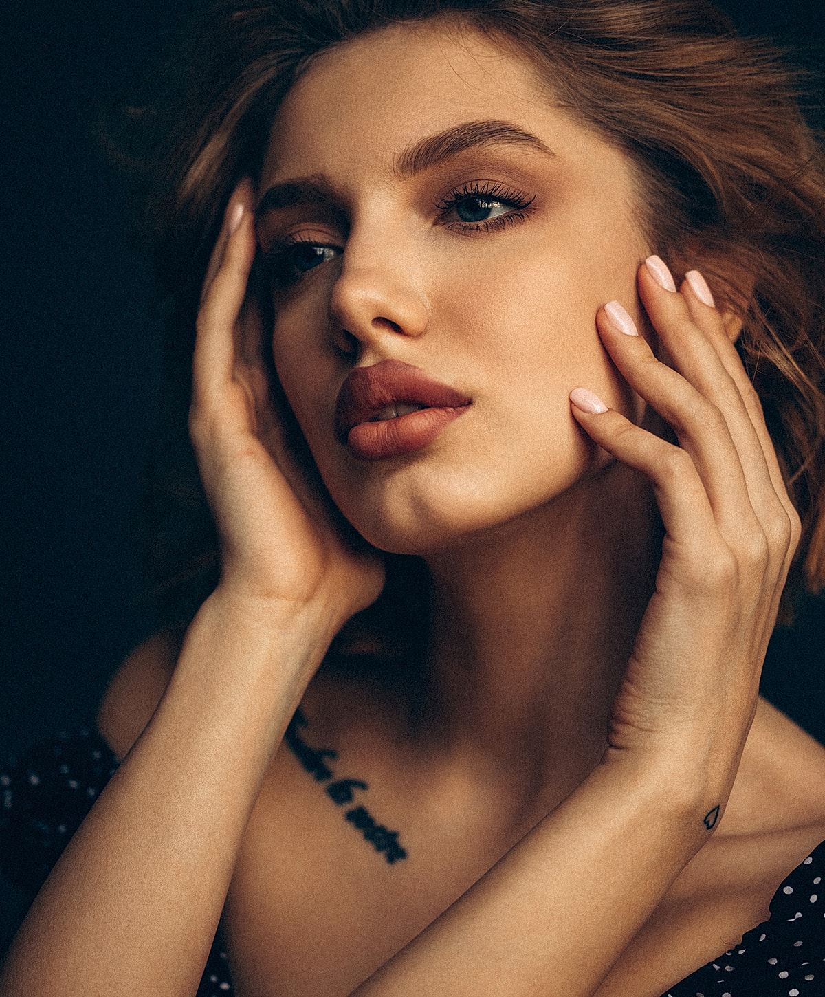 Portrait of a woman with striking features.