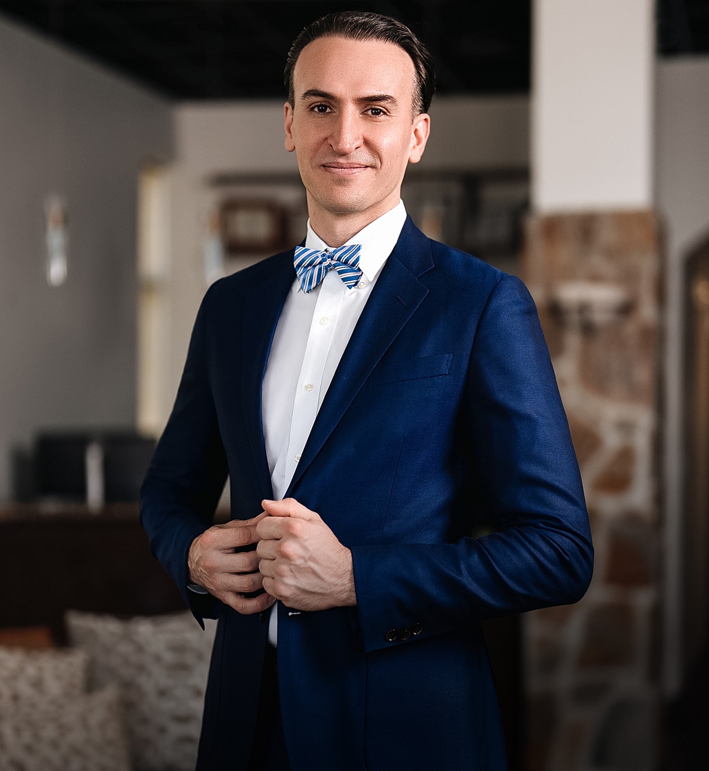 Man in a blue suit with bow tie.