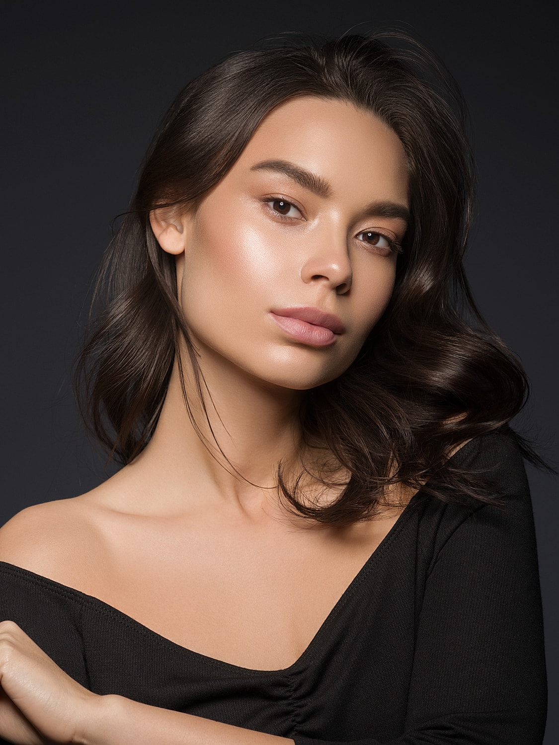 Portrait of a woman with flowing hair.