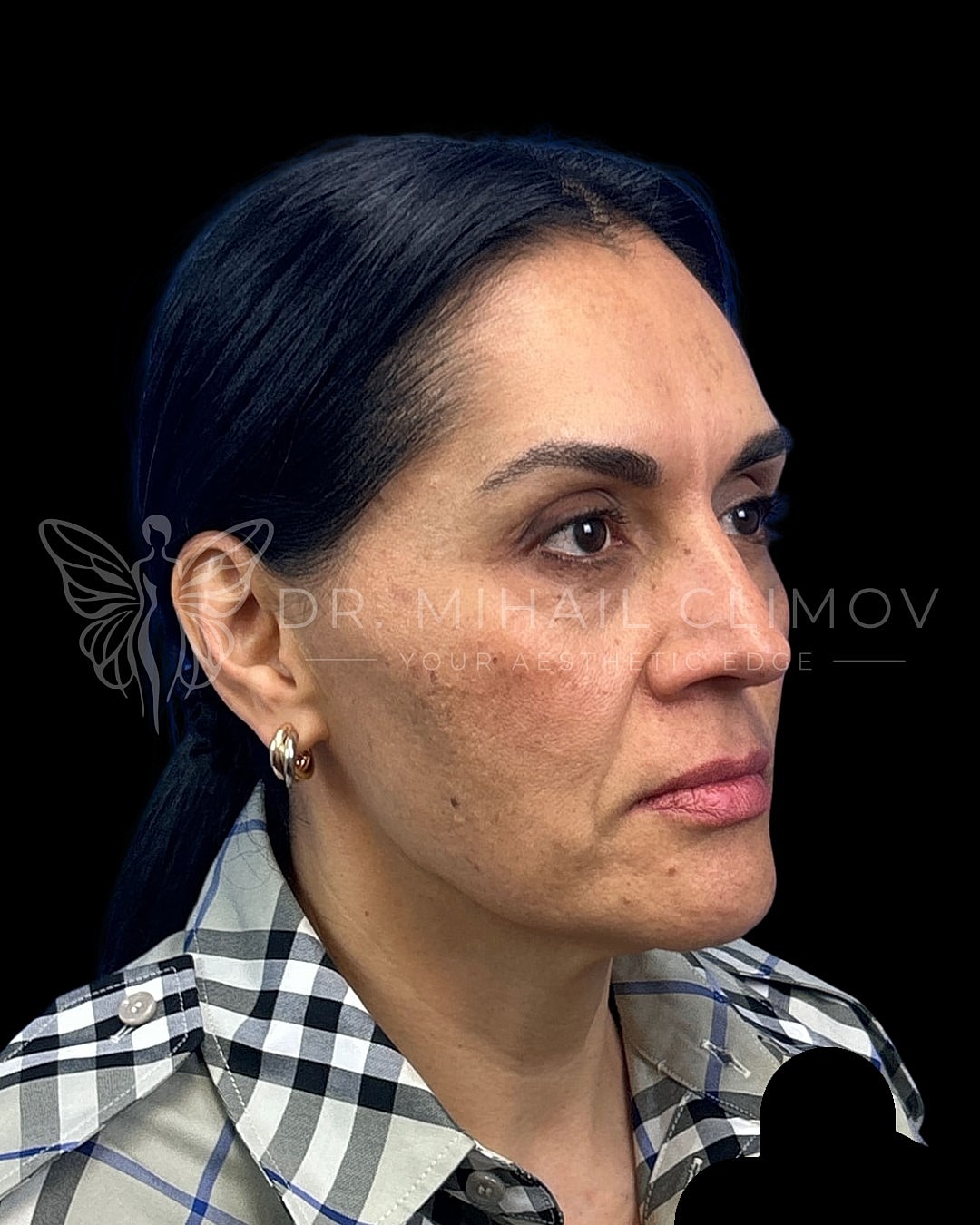 Profile view of a woman with dark hair.