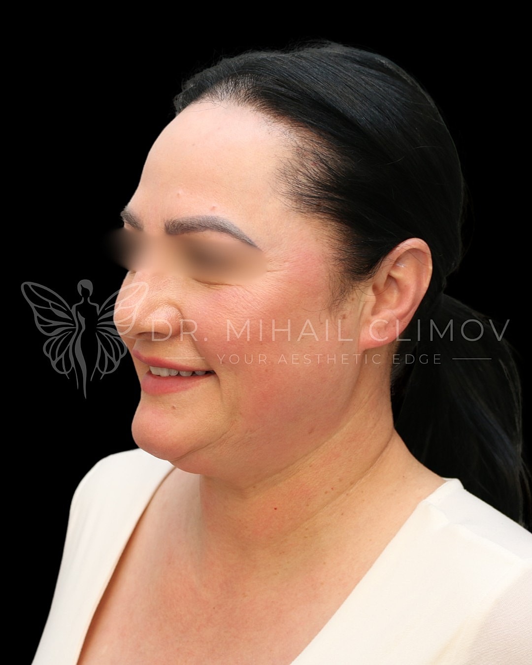 Profile portrait of a smiling woman.