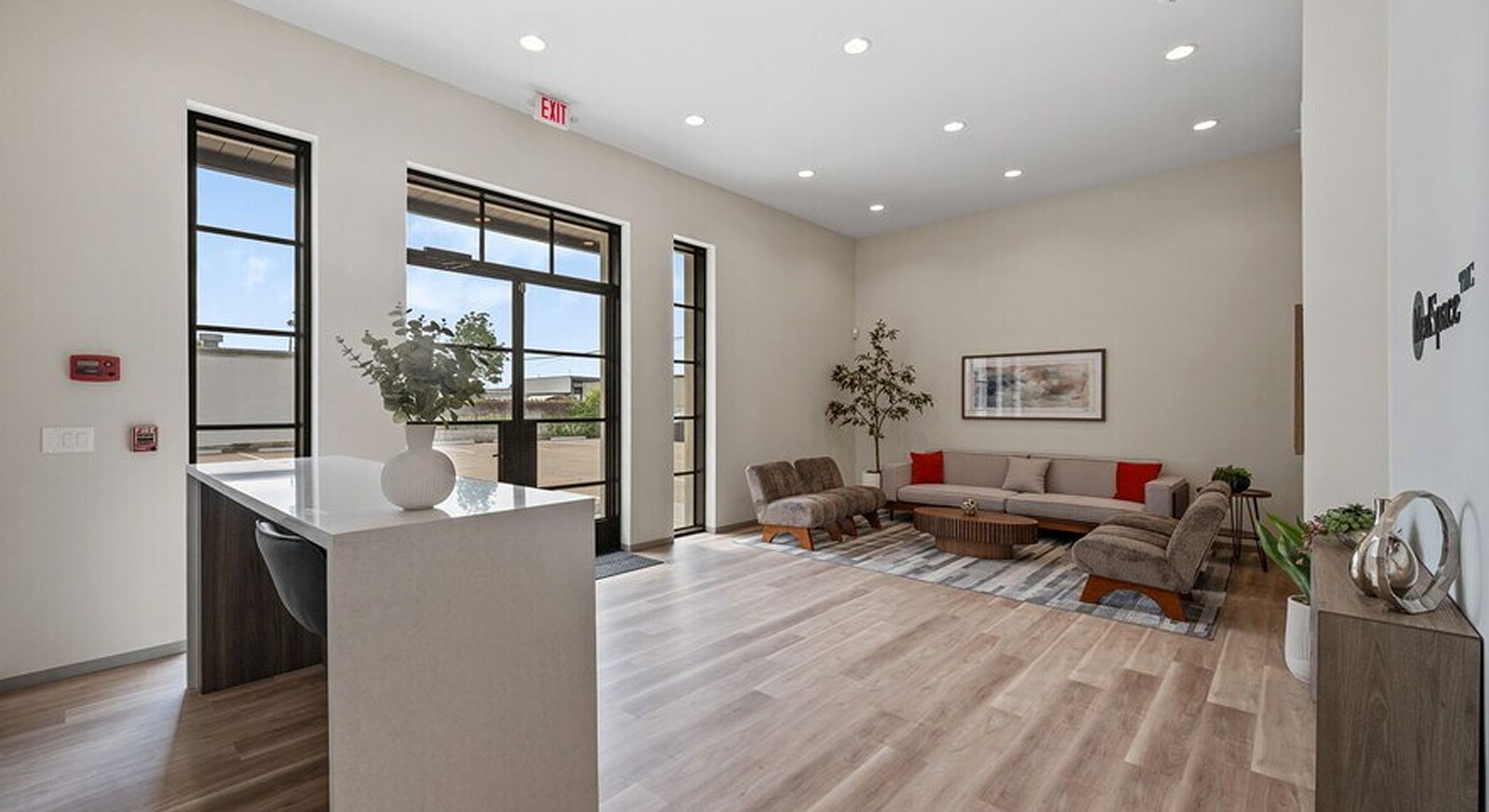 Modern lobby with seating and large windows.