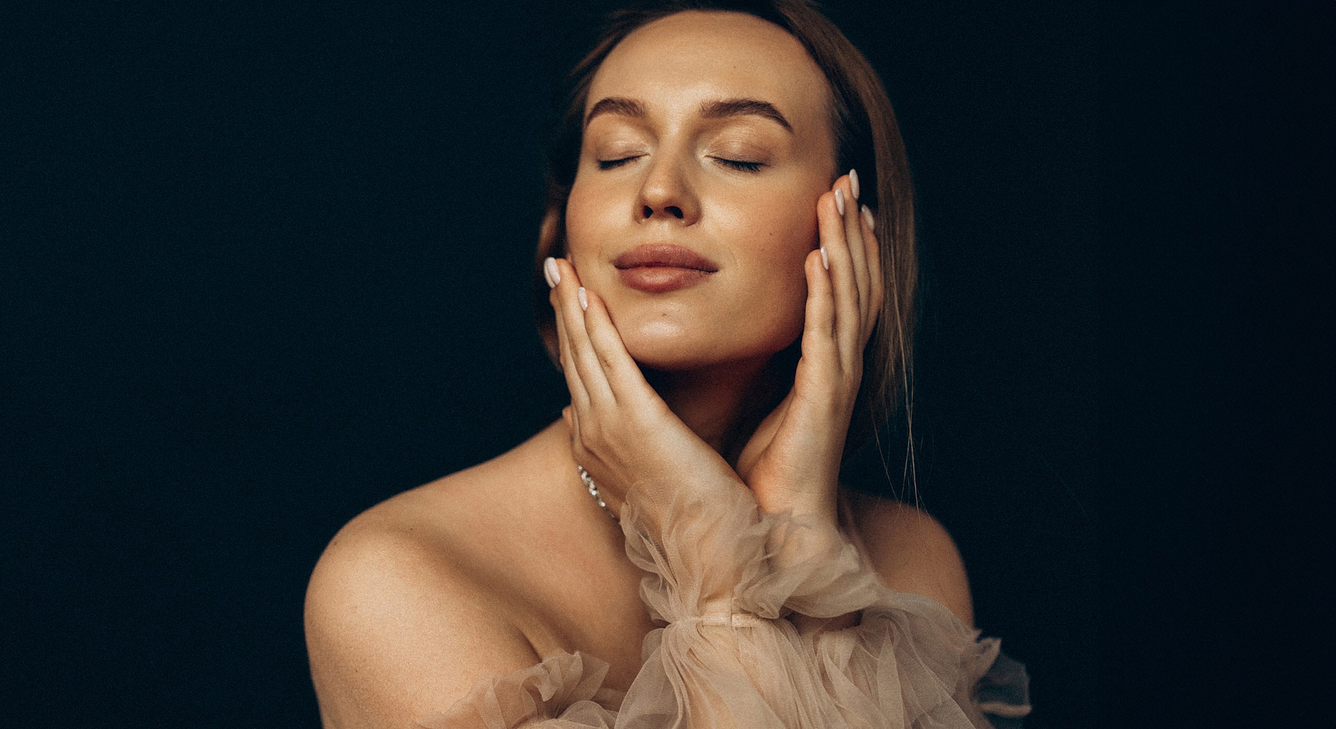 Woman with closed eyes and serene expression.