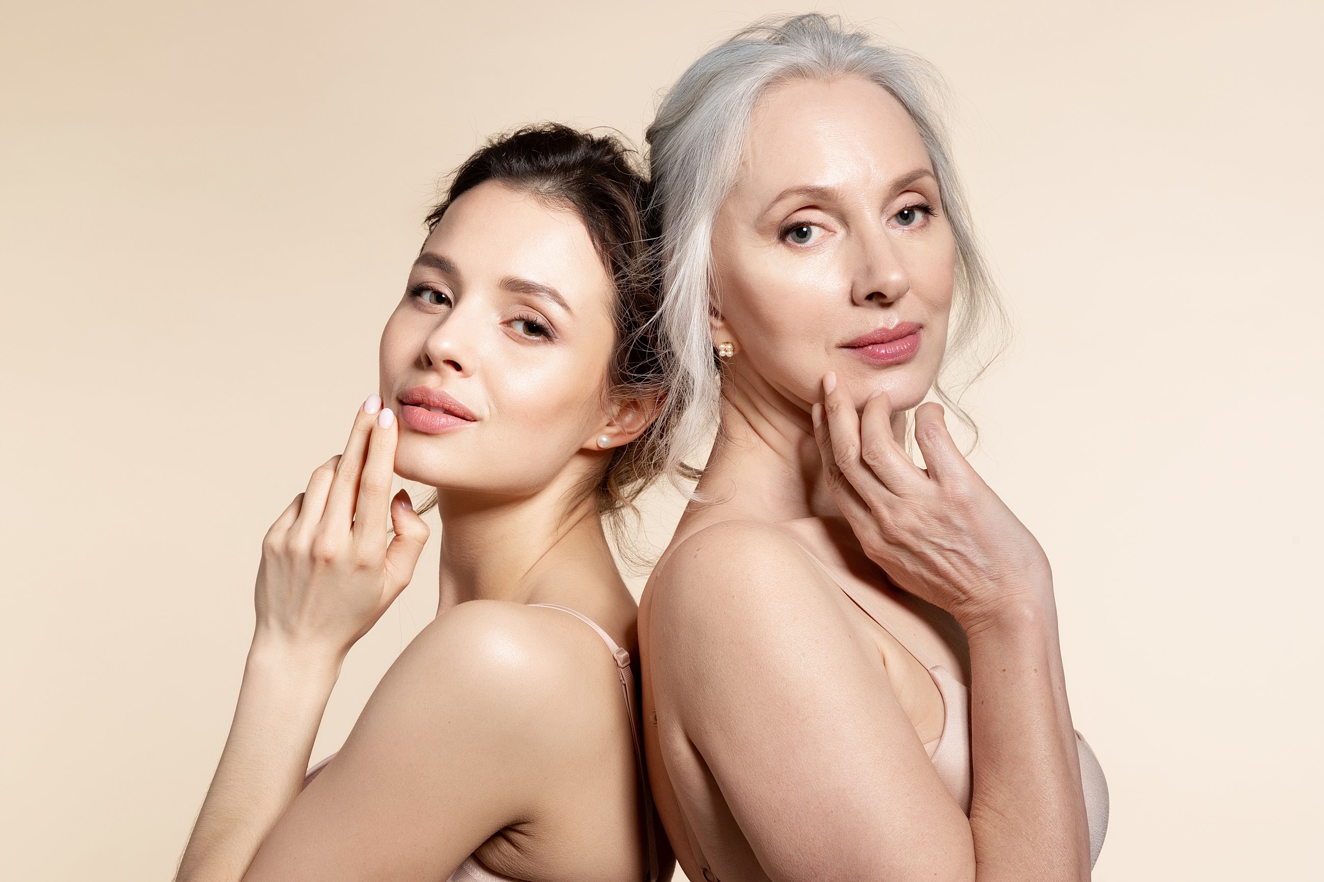 Two women showing skincare and beauty expressions.